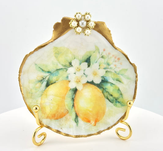 Decorative shell with lemons and flowers on a white background